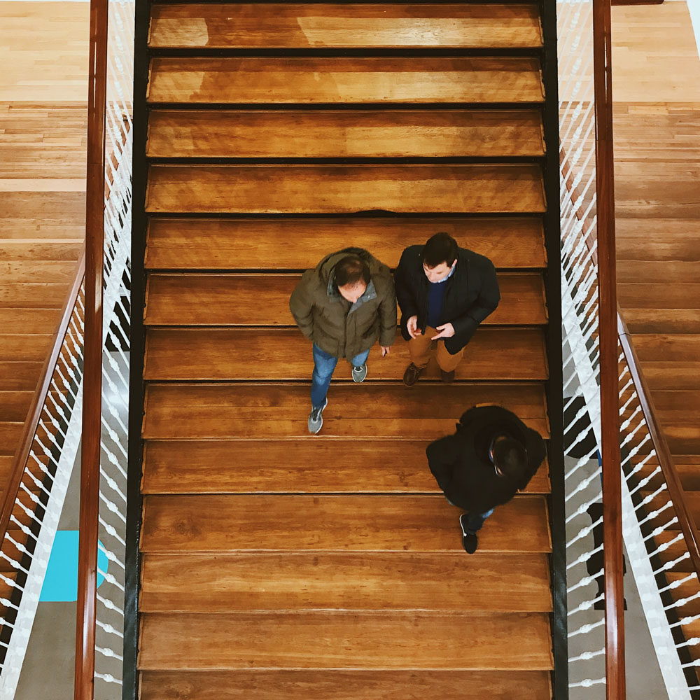 men walking down stairs