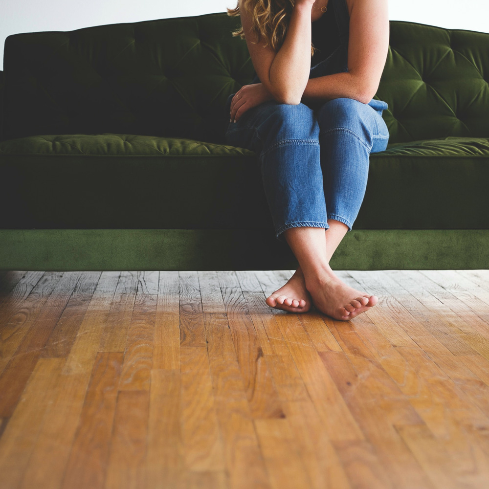 woman sitting on couch